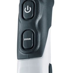 schwarzer powerknopf und zoomknopf an weißem plastikgehäuse